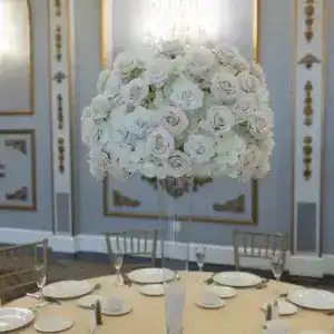 Elegant white floral centerpiece for event decor, perfect for weddings and banquets.
