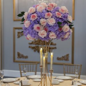 Lavender Hydrangea and Pink Roses on Gold Hourglass Stand with Gold Taper Candle Holders
