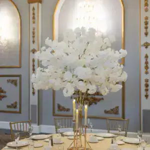 Elegant floral table centerpiece with white blooms for luxury event decor.