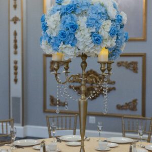 Luxurious blue and white floral centerpiece for elegant event decor.