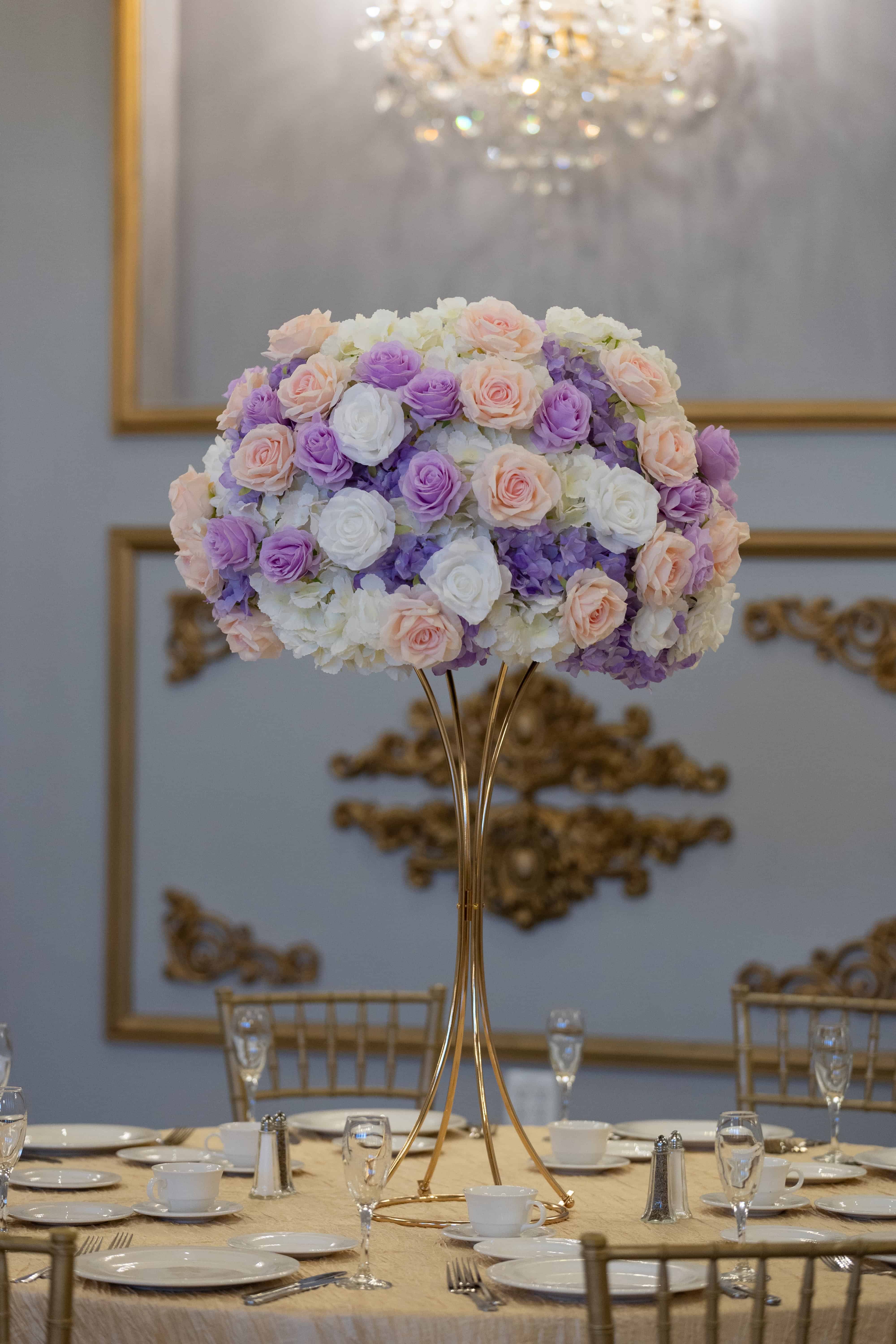 Elegant floral centerpiece with roses and hydrangeas for event decor.