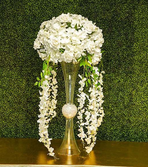 Hydrangea-and-rose-with-greenery-on-Hourglass-vase-with-hanging-florals-and-clear-gems-Centerpiece-Amore-Decor-Rental-19