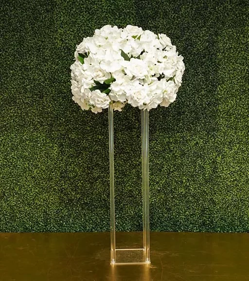Hydrangea-and-rose-with-greenery-on-clear-rectangular-acrylic-stand-Centerpiece-Amore-Decor-Rental-27-webp