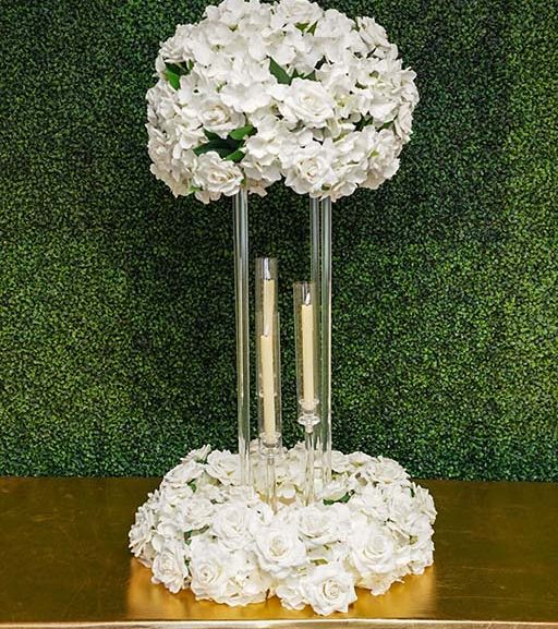 Hydrangea-and-rose-with-greenery-on-clear-rectangular-stand-with-floral-wreath-and-tapper-candle-Centerpiece-Amore-Decor-Rental-118