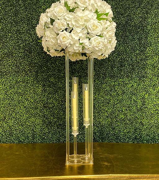 Hydrangea-and-rose-with-greenery-on-clear-rectangular-stand-with-tapper-candles-Centerpiece-Amore-Decor-Rental-86