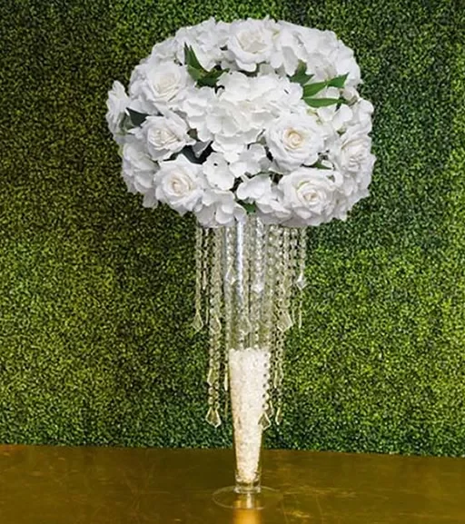 Hydrangea-and-rose-with-greenery-with-Princess-chandelier-on-Pilsner-and-clear-gems-Centerpiece-Amore-Decor-Rental