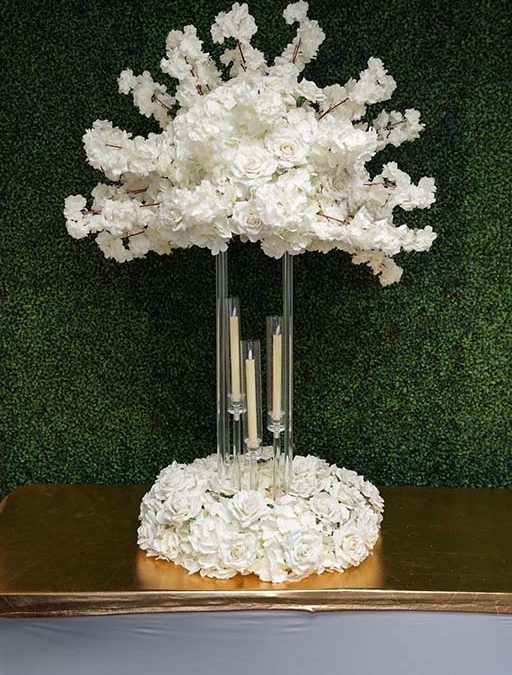 Timeless-centerpiece-on-clear-acrylic-stand-with-floral-wreath-and-tapper-candles-Centerpiece-Amore-Decor-Rental-97